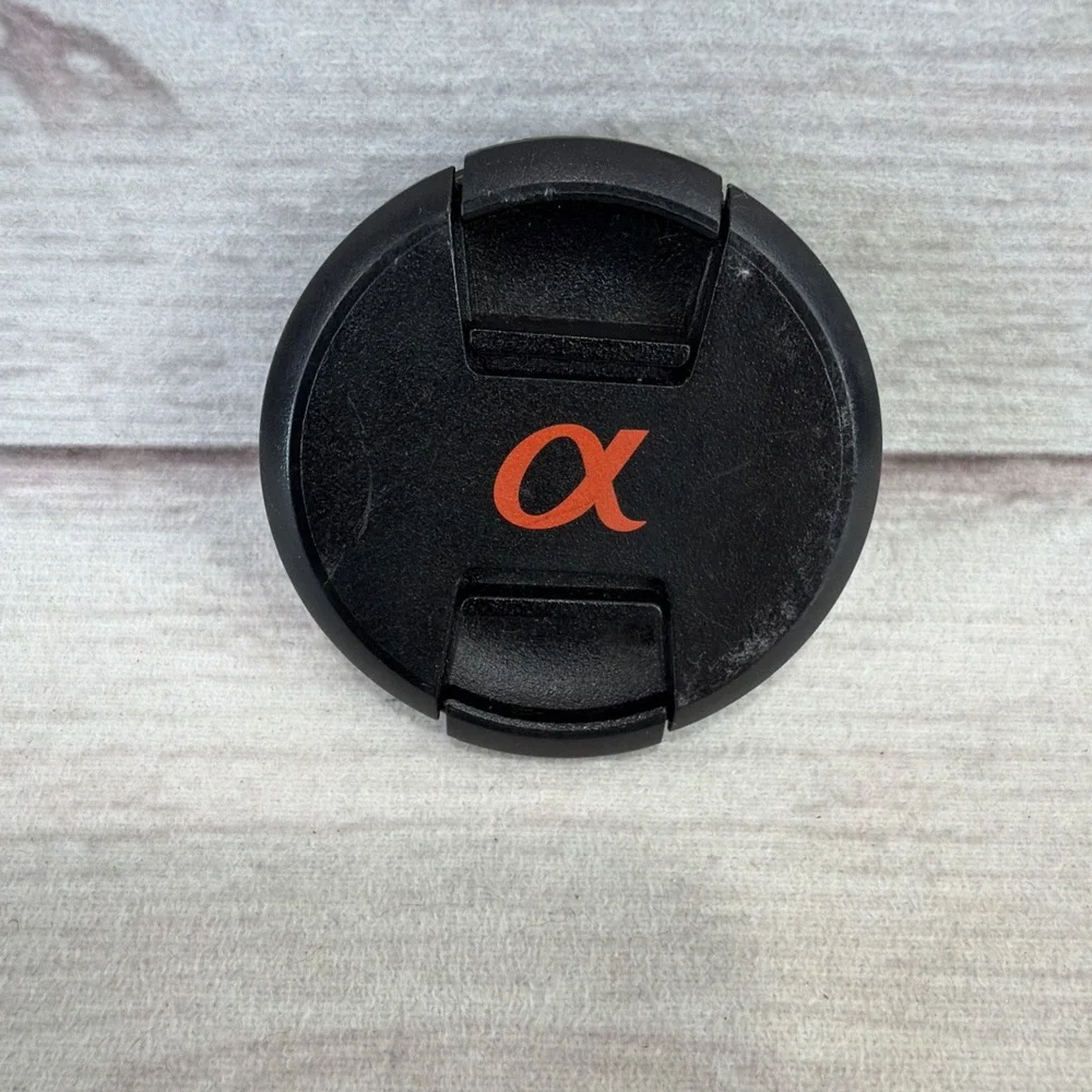 SONY ALPHA 55mm LENS FRONT COVER Black Genuine